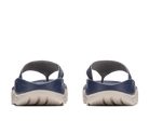 Pair of navy and beige sandals on a white background