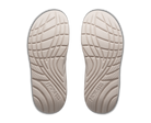 Pair of beige shoe insoles with tread pattern on a white background