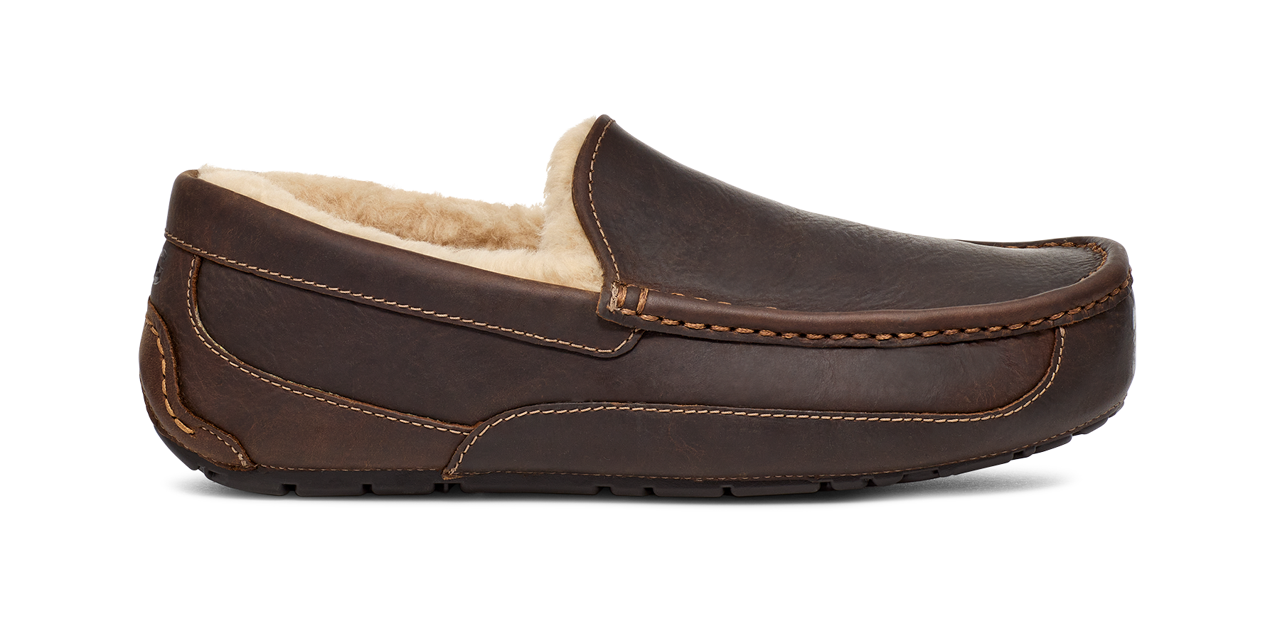 A dark brown leather slip-on driving loafer with a cream-colored shearling lining, shown from a side profile view against a white background.