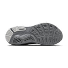 Close-up of a running shoe sole with tread pattern on a white background