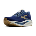 Blue running shoe with brown sole on a white background