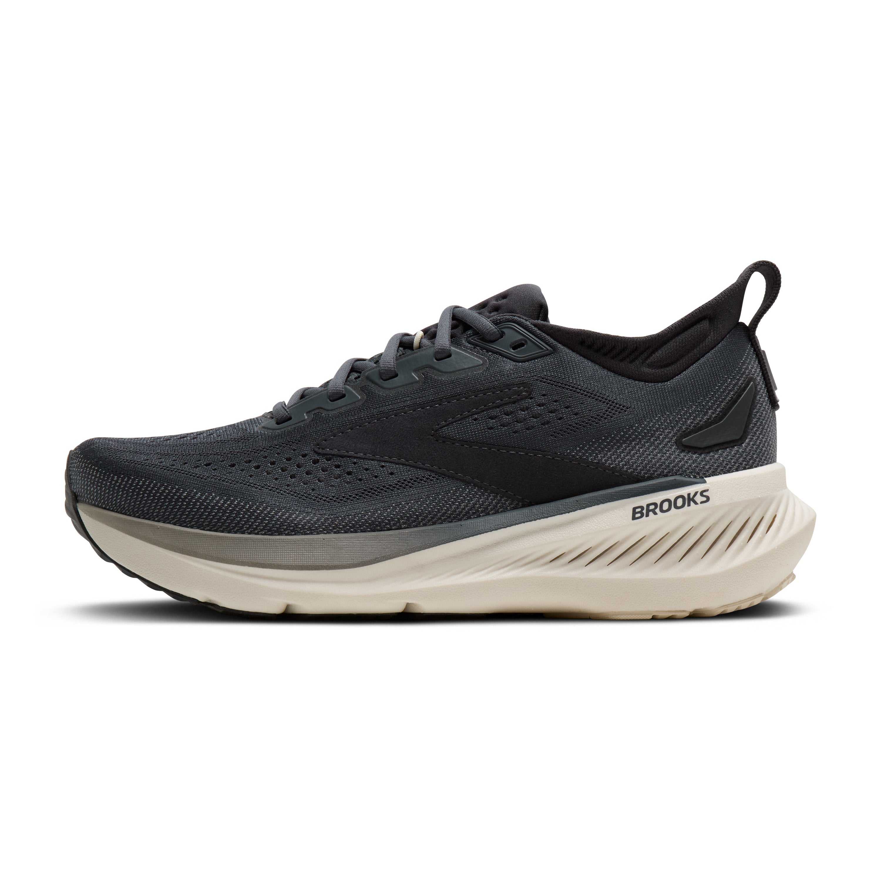A Brooks running shoe in dark gray and black with a thick cream-colored midsole, shown from a side profile on a white background.