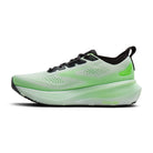 Green running shoe on a white background