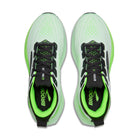 Pair of green and black running shoes with 'Brooks' branding on a white background