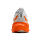 Back view of a running shoe with orange sole and white side panel on a white background