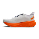 White running shoe with orange sole on a white background