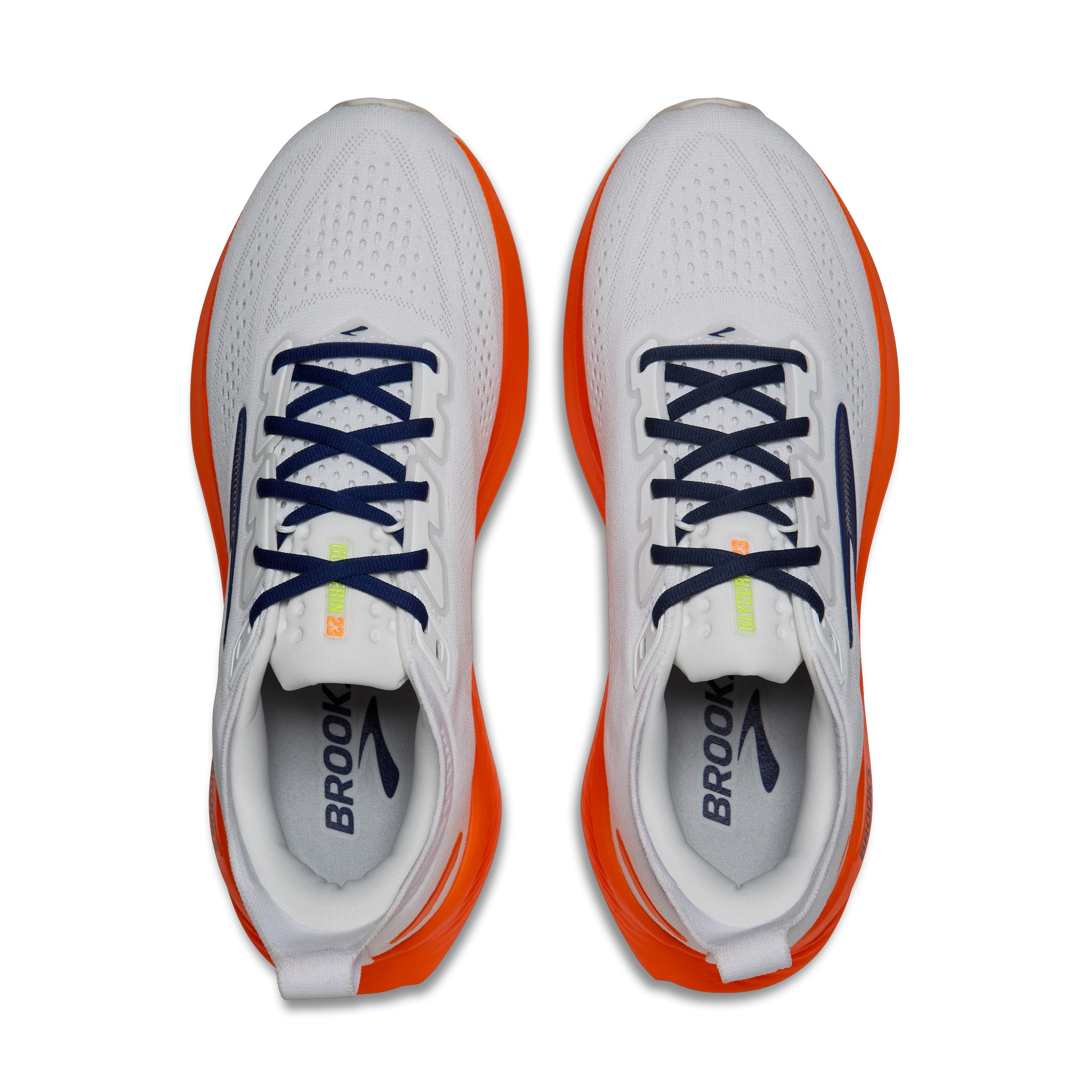 White running shoes with orange accents and blue laces on a white background