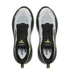Pair of black and white running shoes with green accents on a white background