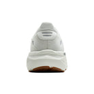 White sneaker with brown sole on a white background
