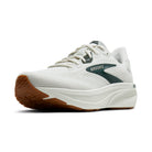 White running shoe with brown sole on a white background