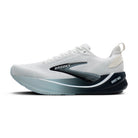 White running shoe with black stripes and pink sole on a white background