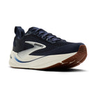 Navy running shoe with white sole on a white background