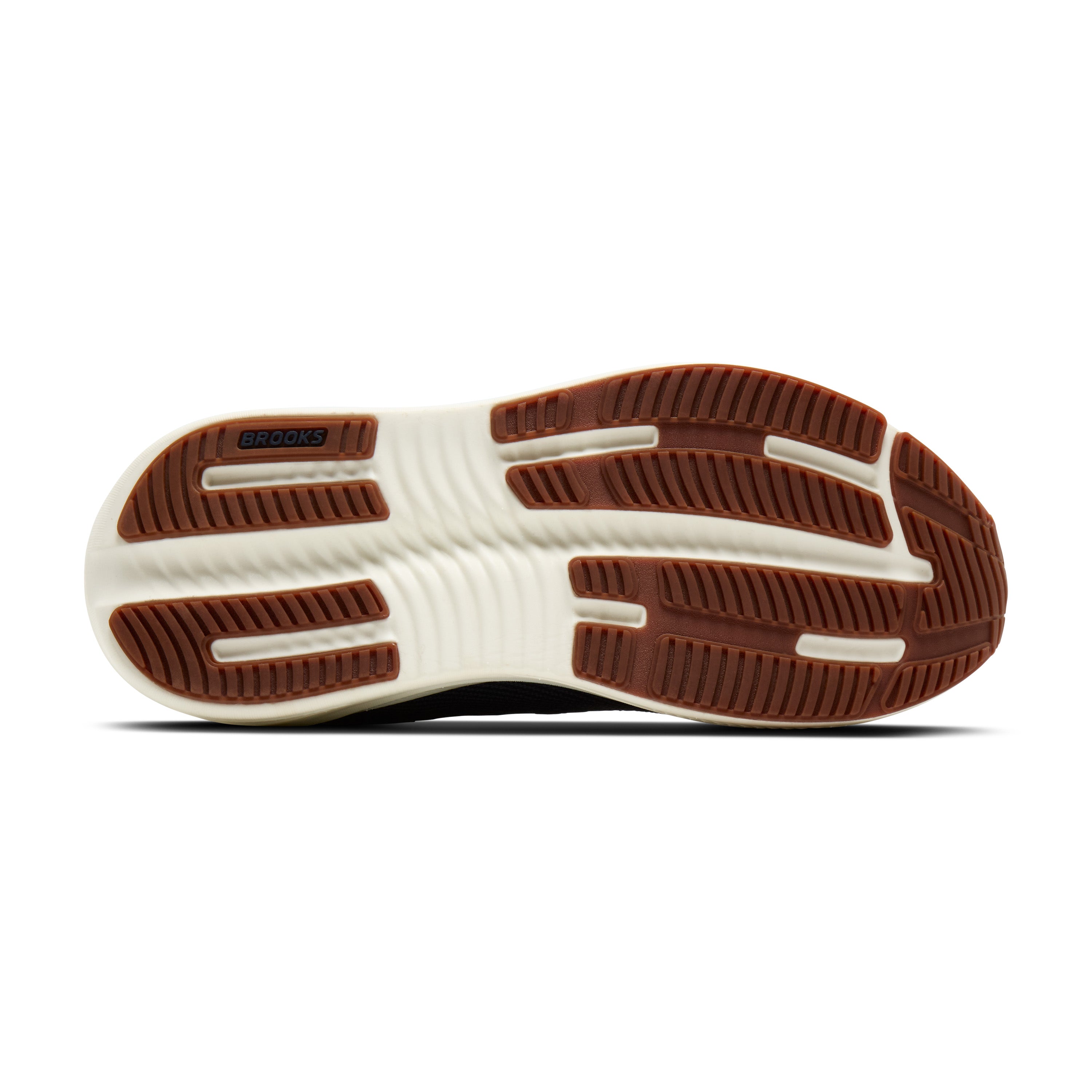 Close-up of a shoe sole with brown and white tread pattern on a white background