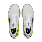 White running shoes with green accents on a white background