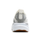 A rear view of a white and gray knit athletic shoe with a thick white midsole and a brown outsole, shown on a plain white background.