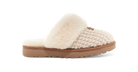 Slipper with knitted pattern and fluffy white sole on a white background