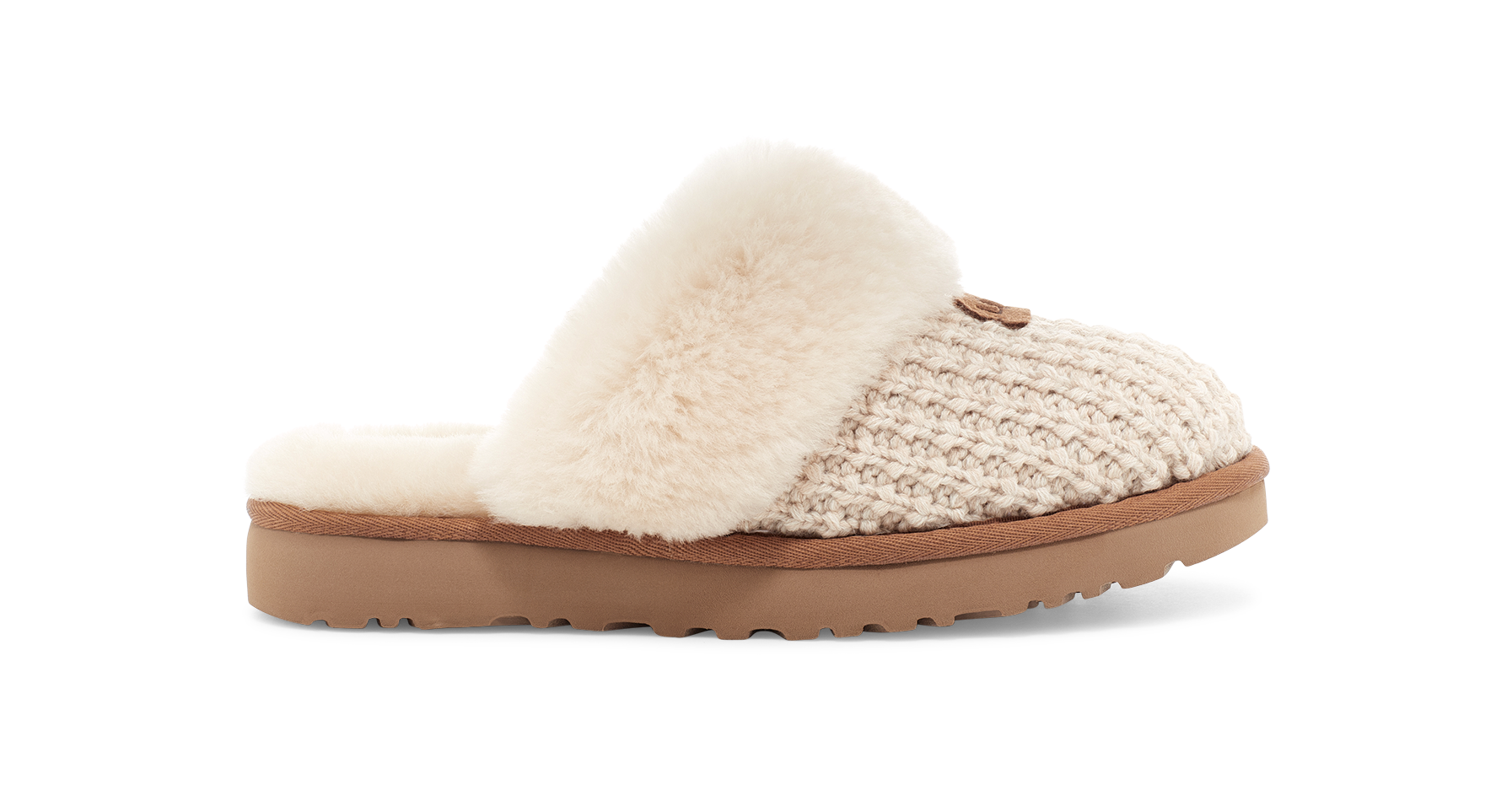 Slipper with knitted pattern and fluffy white sole on a white background