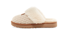 A single slip-on slouchy slipper with a beige knit upper, cream faux fur trim, and a brown sole, shown from the side on a white background.