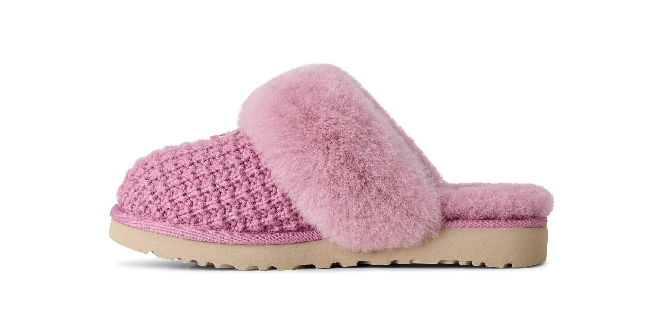 A pink knit slip-on mule slipper with a fluffy faux-fur trim and a beige sole, shown in profile against a white background.