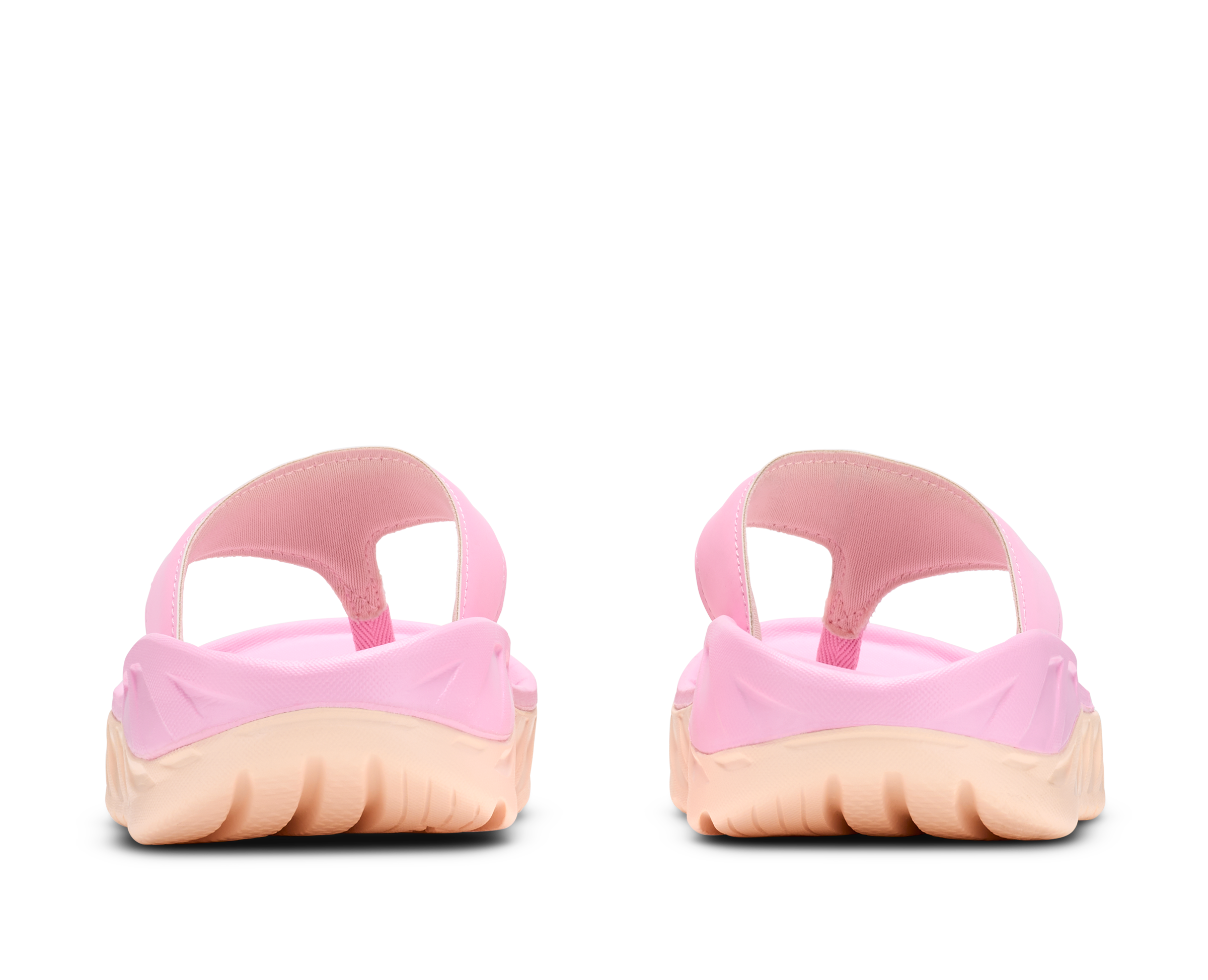 Pair of pink and beige ballet shoes on a white background