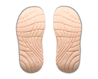 Pair of beige shoe insoles with textured surface on a white background