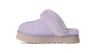 A single light purple slipper with a fluffy faux-fur trim and a beige platform sole, shown from the side on a white background.