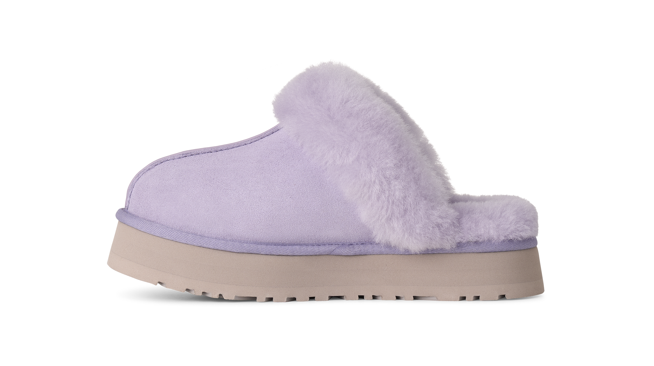 A single light purple slipper with a fluffy faux-fur trim and a beige platform sole, shown from the side on a white background.
