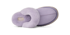 A single UGG slipper in light purple/lavender suede with a fluffy faux-fur trim, shown from a side profile view on a white background.