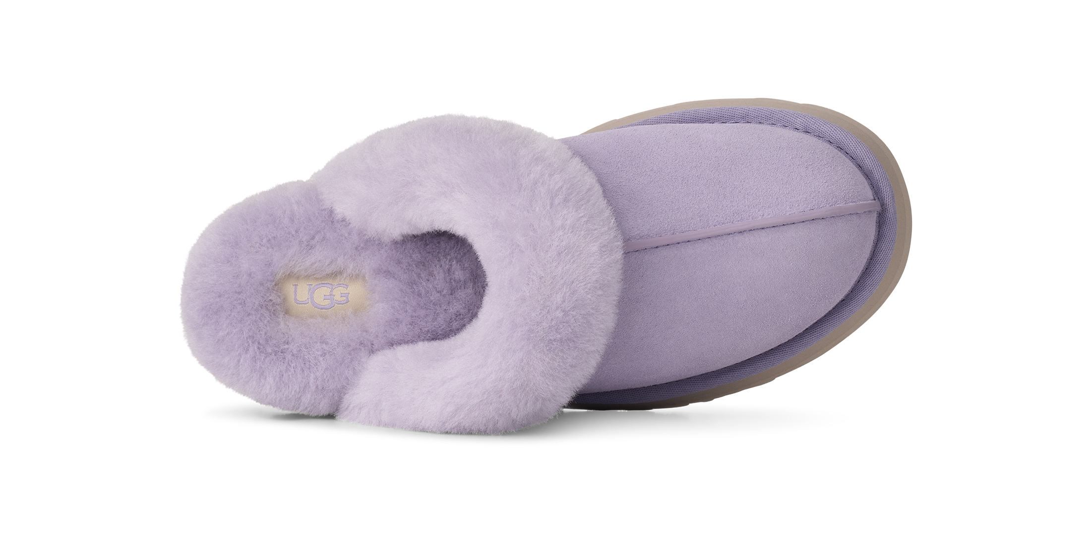 A single UGG slipper in light purple/lavender suede with a fluffy faux-fur trim, shown from a side profile view on a white background.