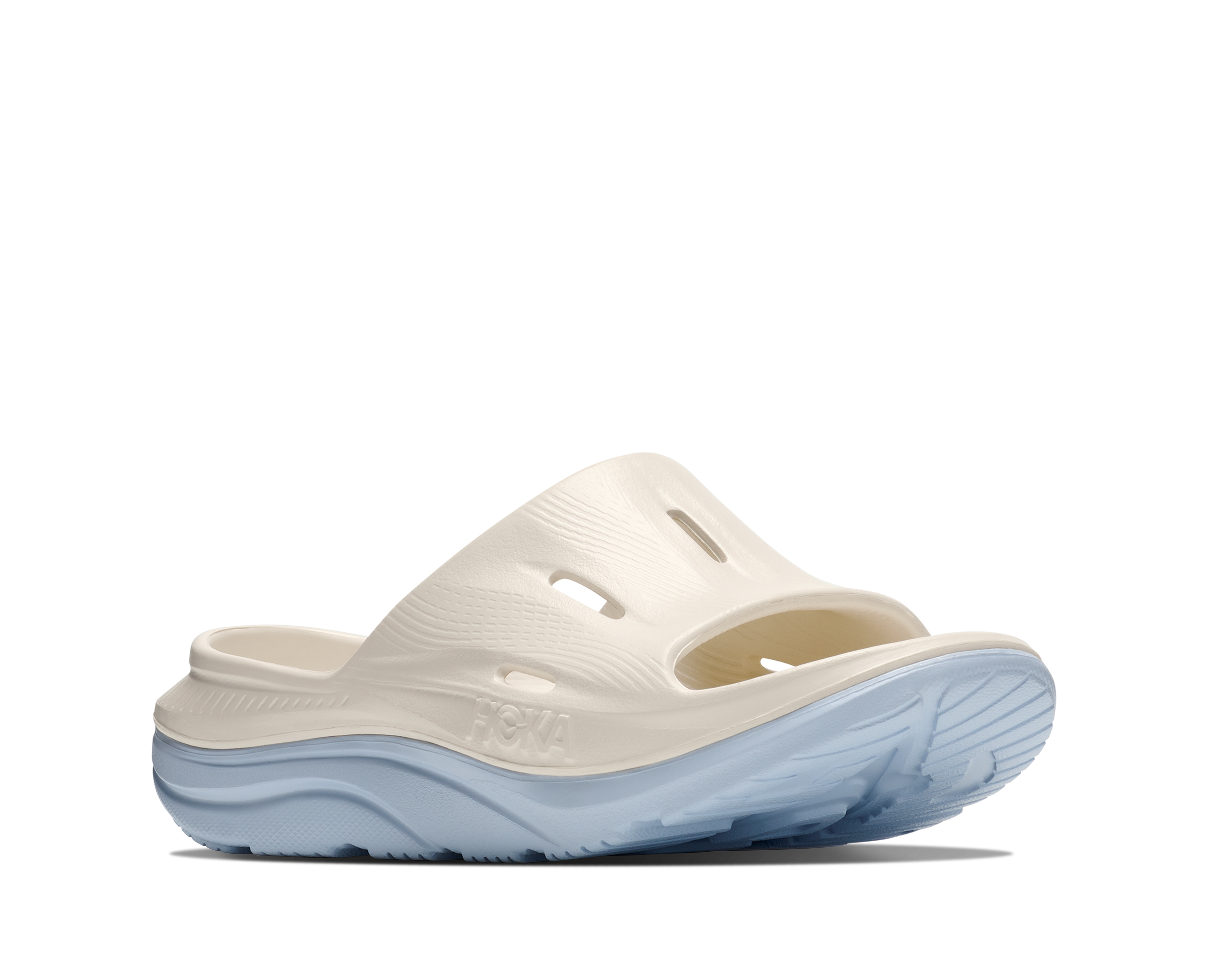 White sandal with blue sole on a white background