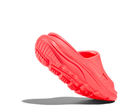 Red slip-on shoe with a textured sole on a white background