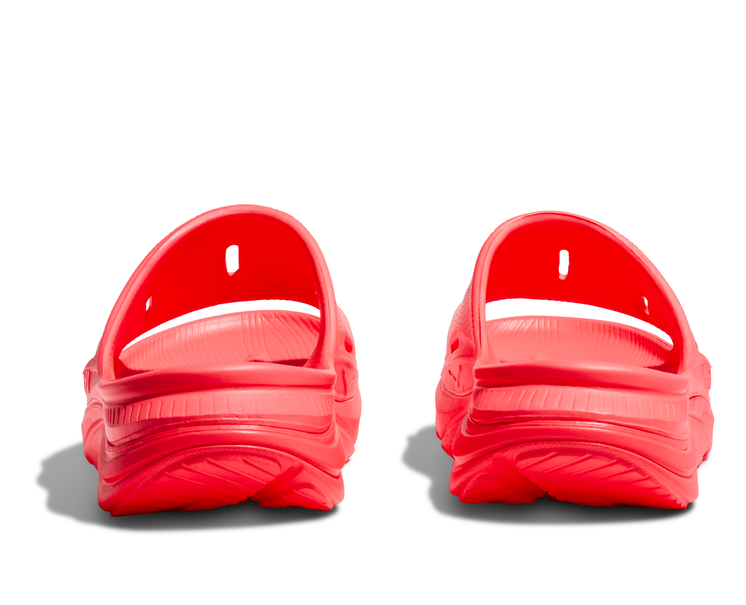 Pair of red clogs on a white background