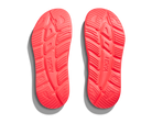 Red shoe soles with 'Hoka' branding on a white background