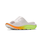 White slide sandal with orange and green sole on a white background