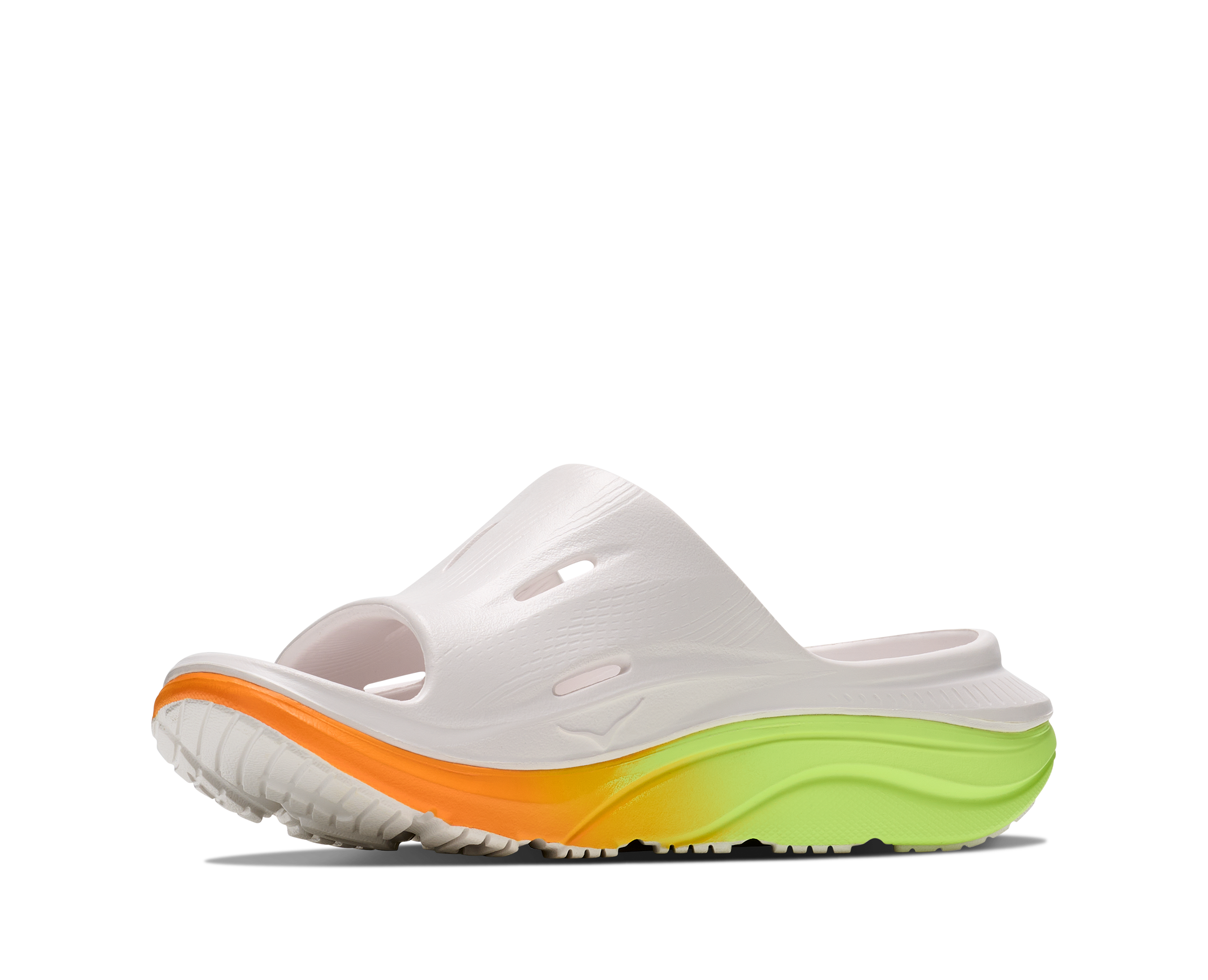 White slide sandal with orange and green sole on a white background