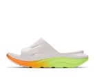 White slide sandal with orange and green sole on a white background