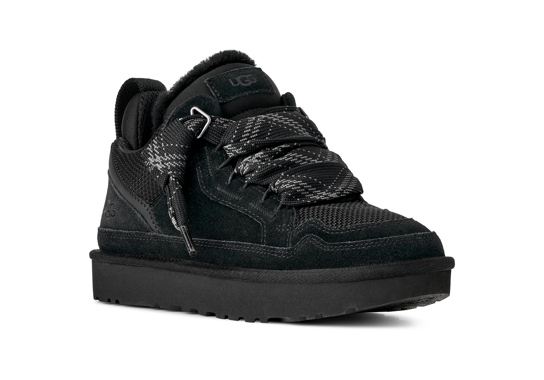 Black sneaker with a textured pattern on a white background