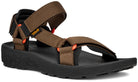 Brown sandal with orange accents on a white background