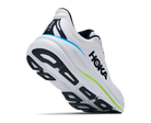 White running shoe with black and green accents on a white background