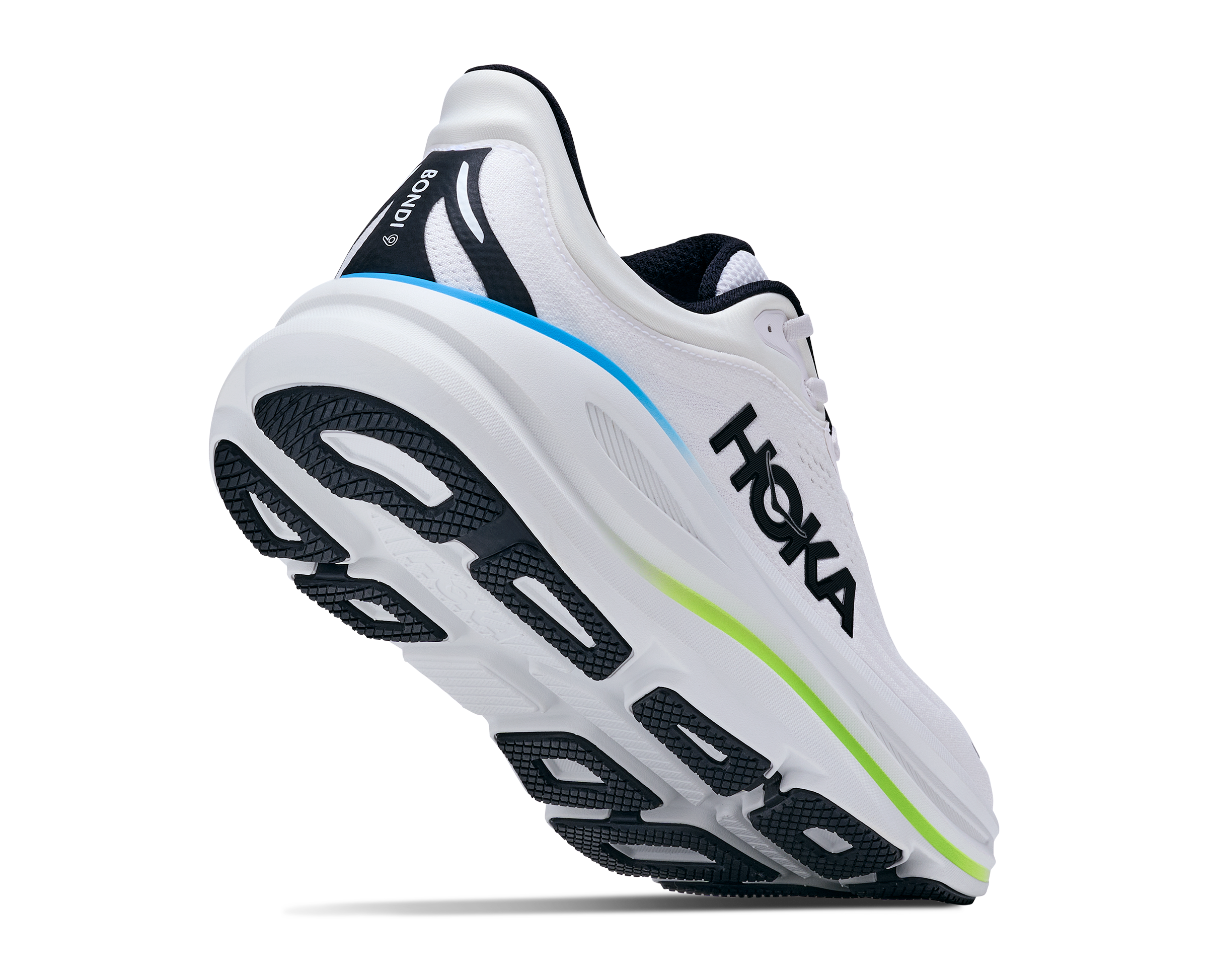 White running shoe with black and green accents on a white background