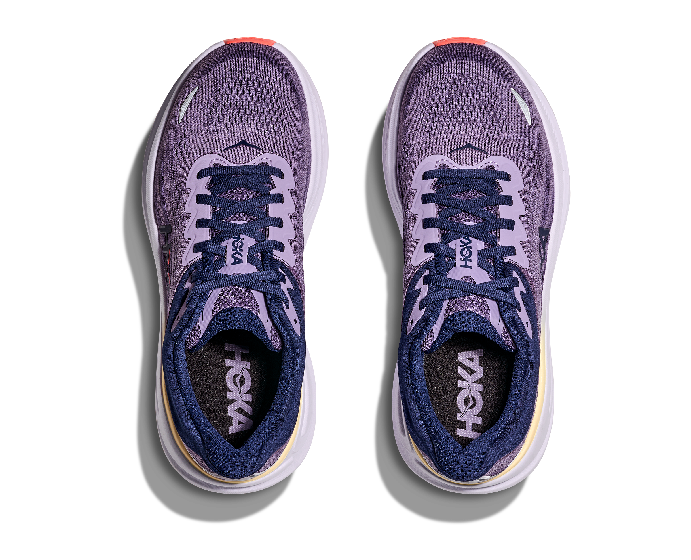 Pair of purple running shoes with 'Hoka' branding on a white background