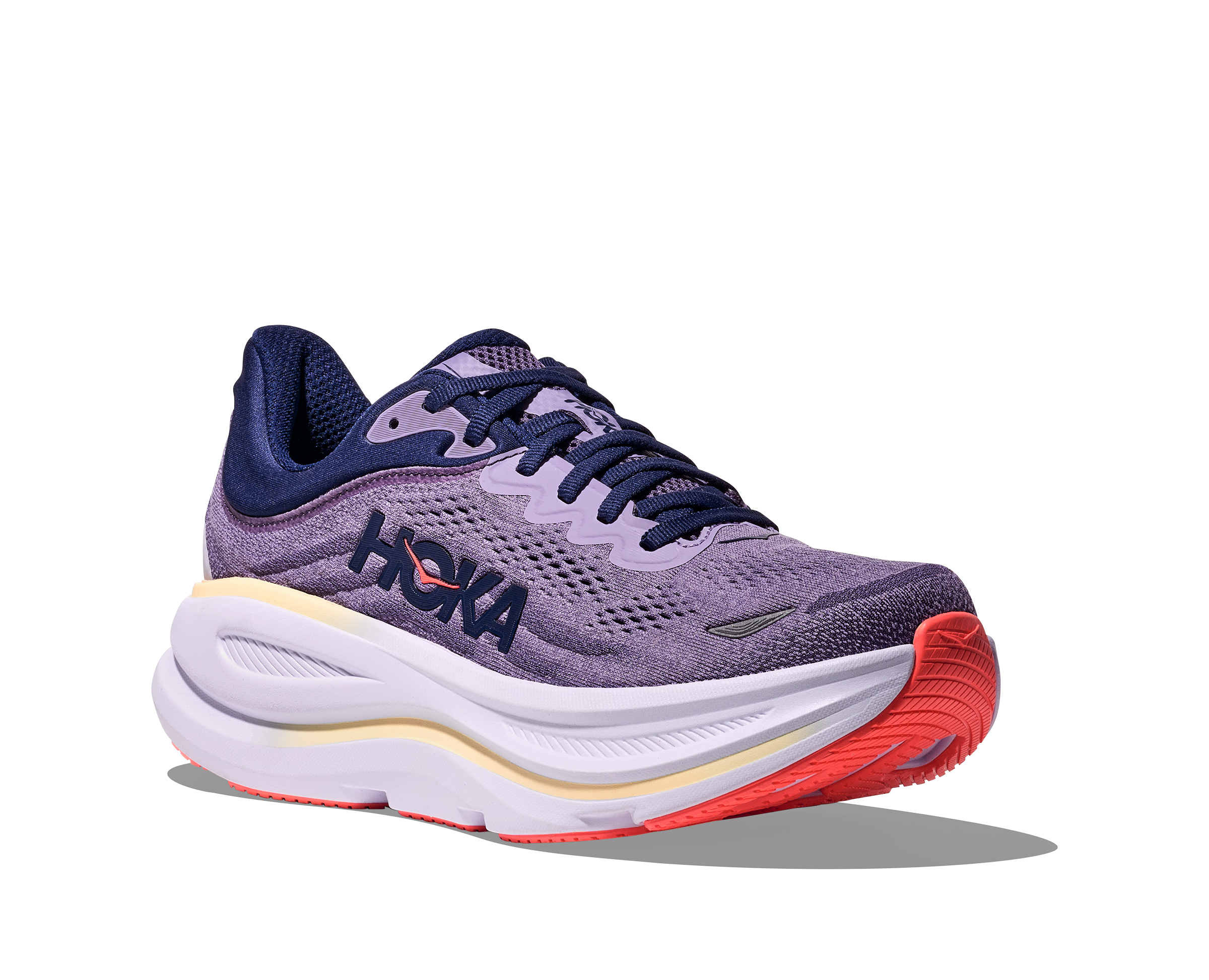 Purple running shoe with red sole on a white background