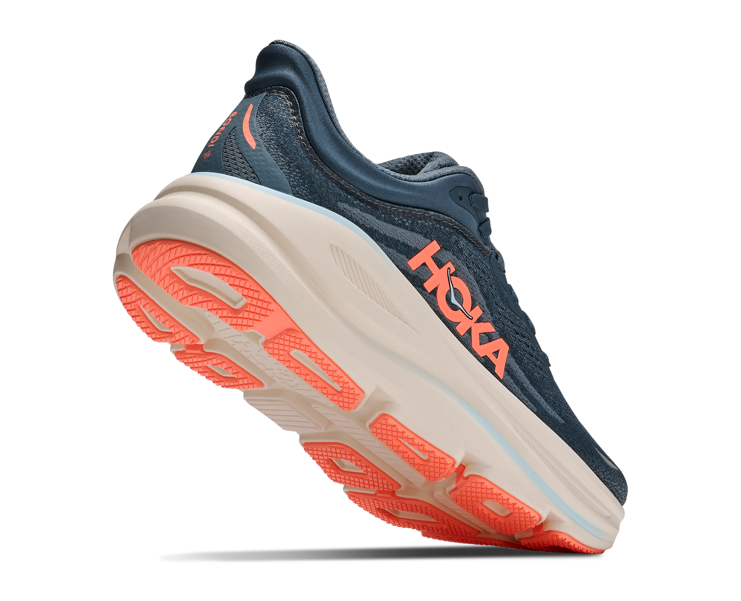 Navy running shoe with orange sole on a white background