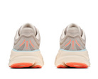 Pair of running shoes with orange accents on a white background