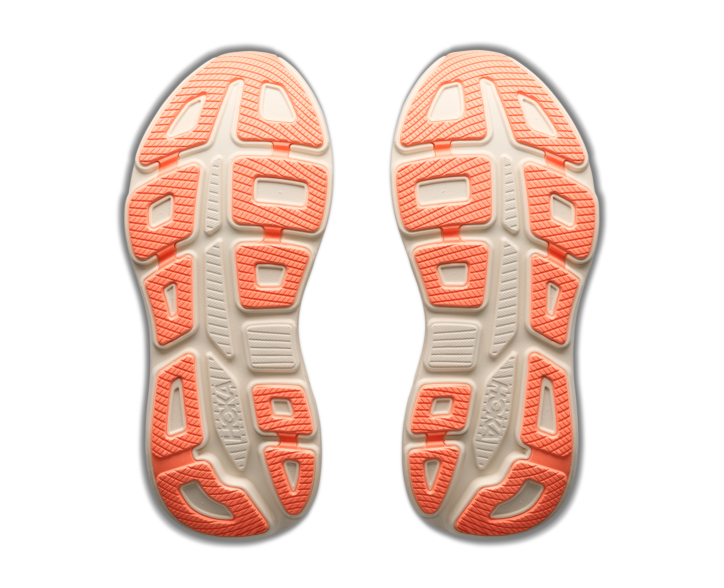 Close-up of the sole of a shoe with orange and white pattern on a black background