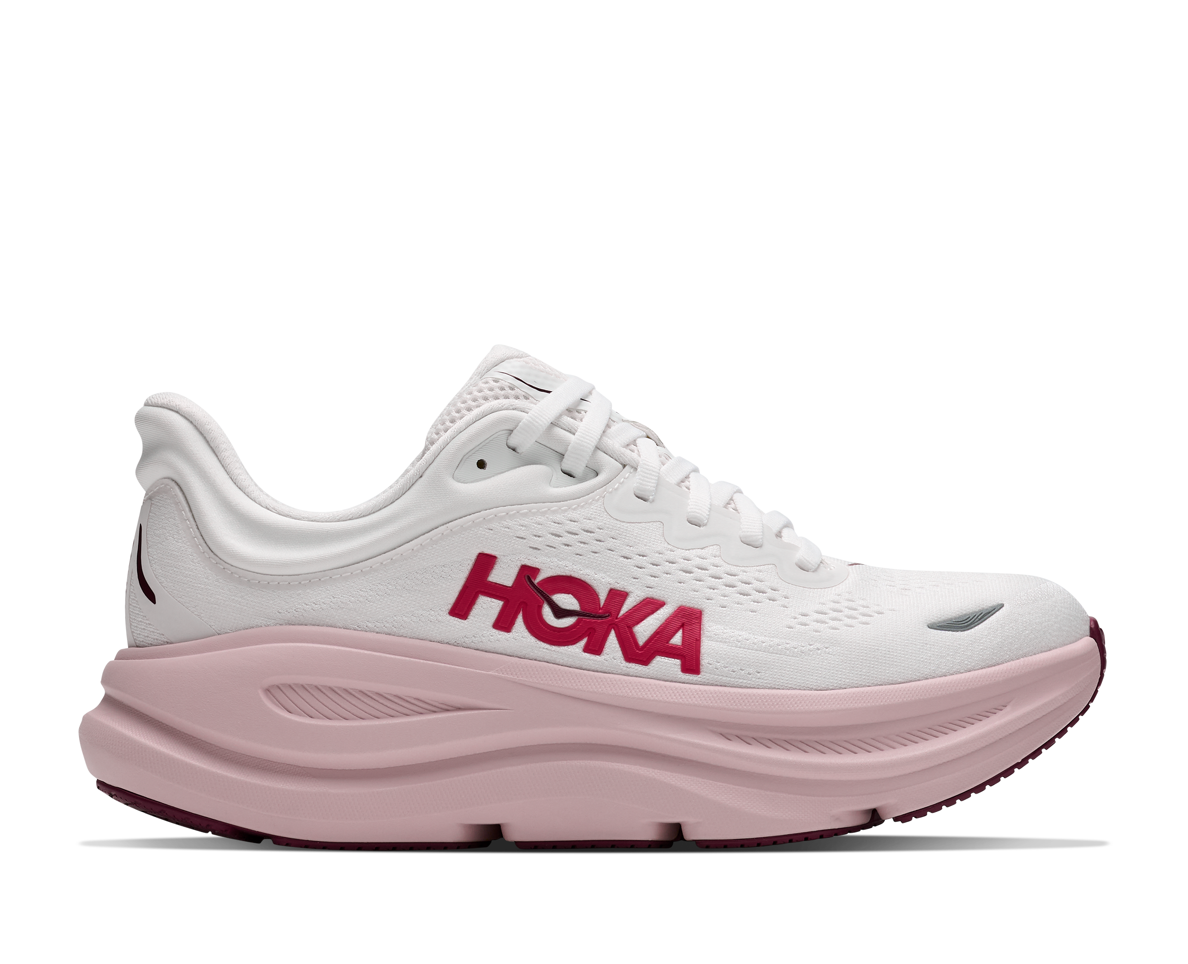 White running shoe with pink sole and 'Hoka' branding on a white background