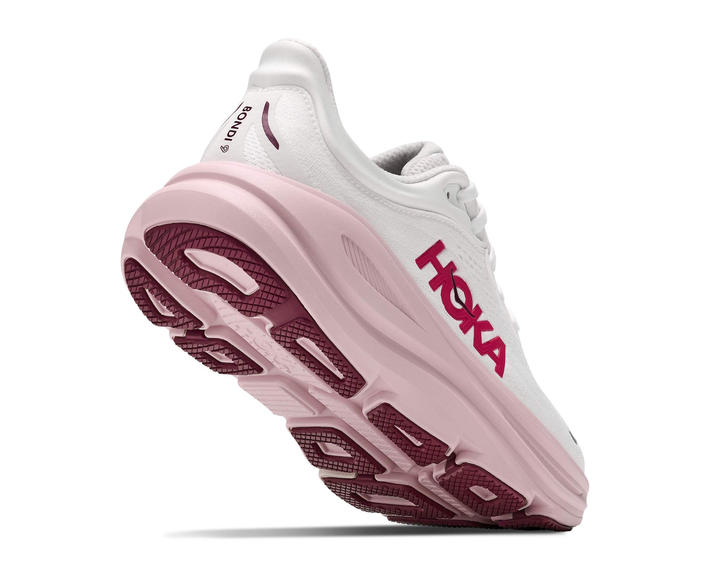 White running shoe with pink sole on a white background