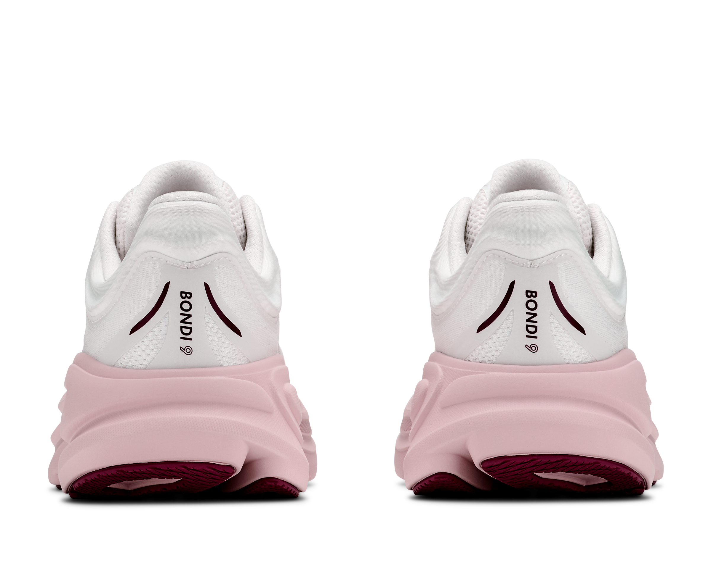 White running shoes with pink soles on a white background