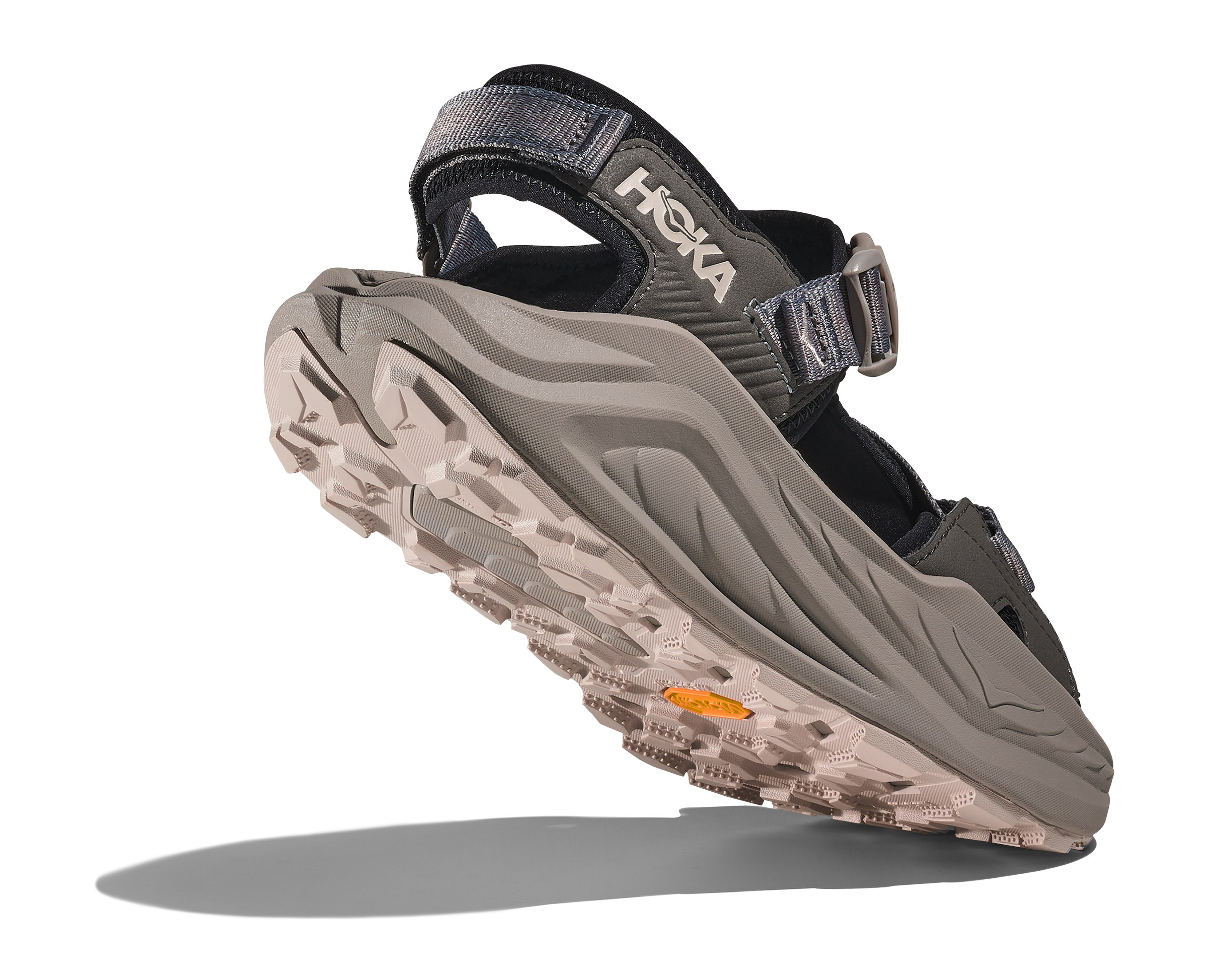 Hoka sandal with a textured sole on a white background