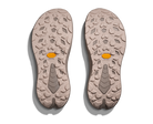 Two shoe soles with a textured pattern on a white background
